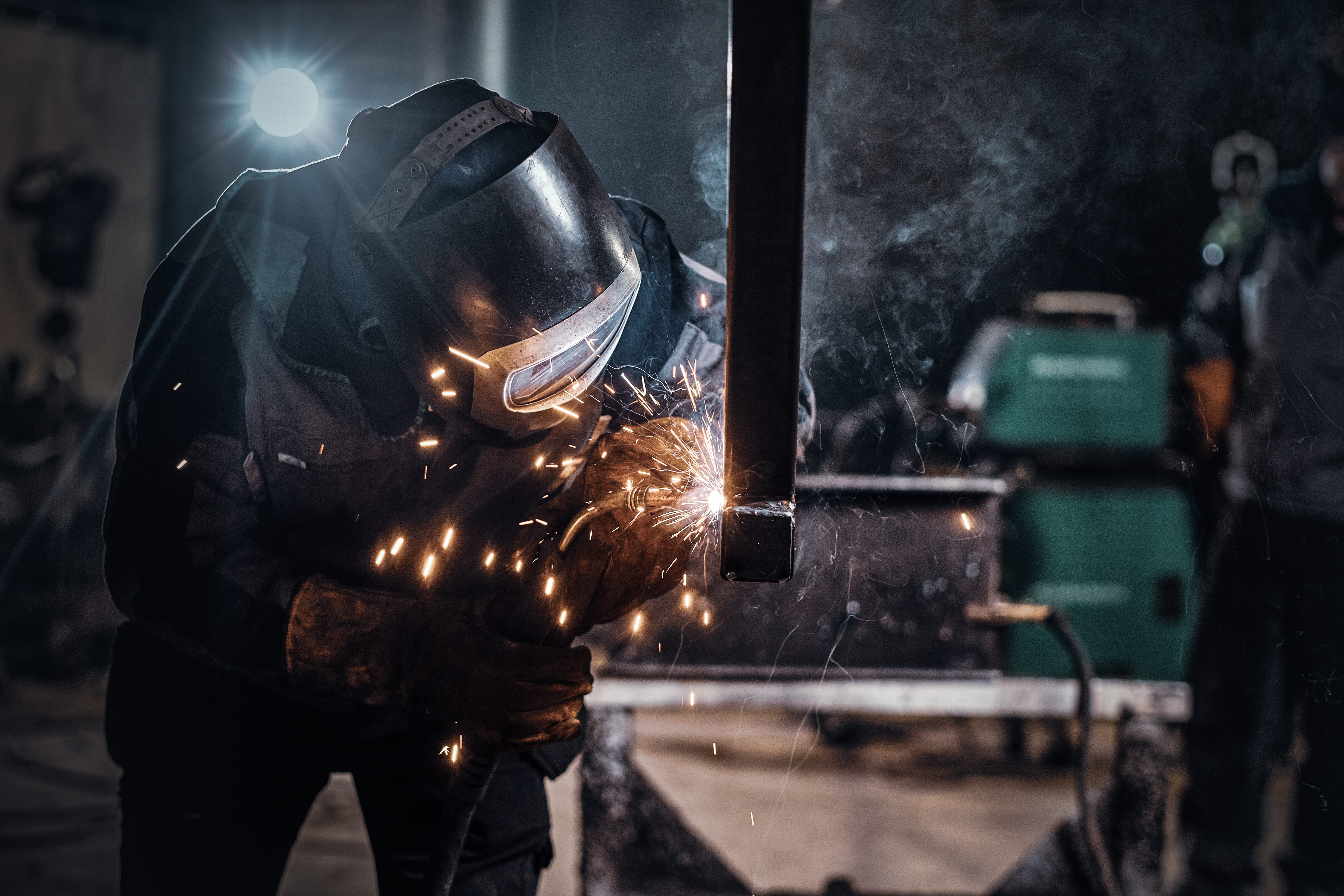 man-is-working-metal-factory-he-is-welding-piece-rail-using-special-tools (2) (1).jpg
